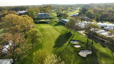 Aerial photo of a golf fairway with trees and sandtrap