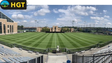 Athletic field with green turf grass 